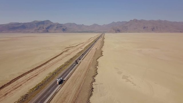 Dusty highway on the oriental yellow desert in Iran
