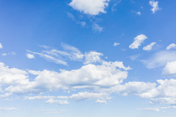 Naklejka na ściany i meble Blue sky on a sunny day with fluffy clouds