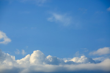 Naklejka na ściany i meble sunlight through fluffy white cloud on clear blue sky background
