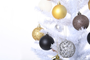 White Christmas Tree Set on a white Background with colored baubles