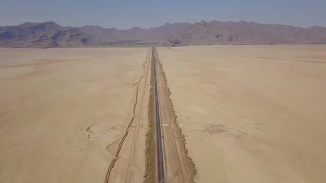 Dusty highway on the oriental yellow desert in Iran