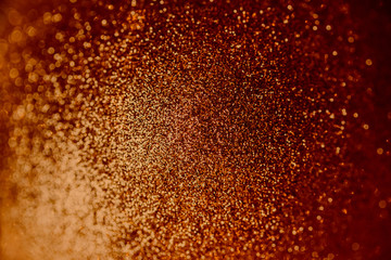 Fototapeta na wymiar Lush lava red blinking background with glitter. Shining flare blurred bokeh texture. Trendy concept color, empty place.