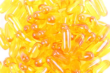 Fish oil capsules on white background