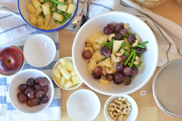 Fototapeta na wymiar Fruit and vegetable salad in the kitchen