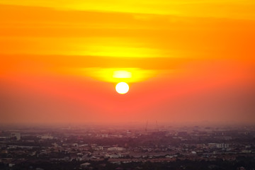 Sunrise sunset in the city with selective focus on the sun