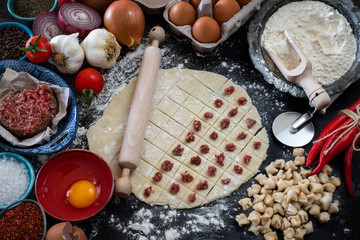 Turkish ravioli mantı preparation with meat, yogurt, butter and dough