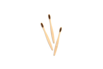 Bamboo toothbrushes on white background
