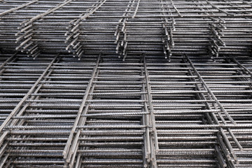 Rebar, reinforcing bars or steel close up, reinforcement steel, wires mesh of steel used as a tension device in reinforced concrete.
