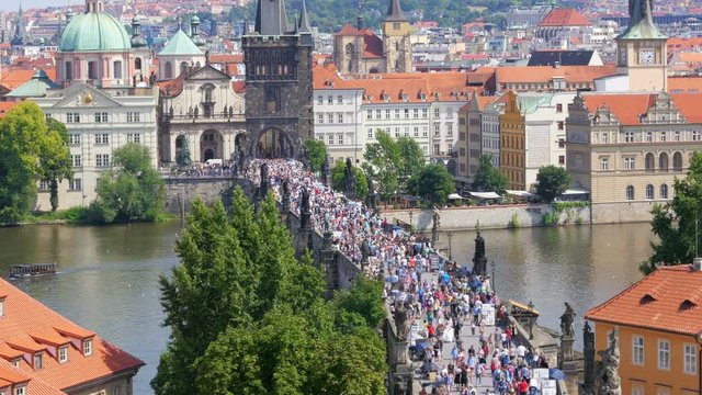prague castle view, people walking crossing charles bridge, czech republic