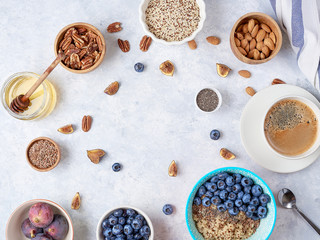 Healthy breakfast of superfoods, quinoa, honey, nuts, figs, coffee. Top view