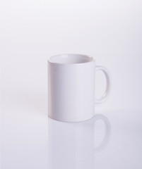 cup or white ceramic mug on background new.
