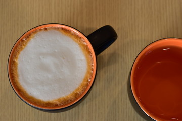 cup of coffee on wooden table