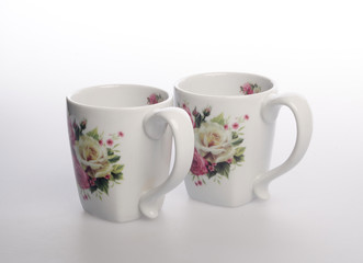 cup or hand painted flower ceramic mug set on the background new.