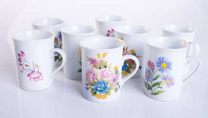 cup or hand painted flower ceramic mug set on the background new.