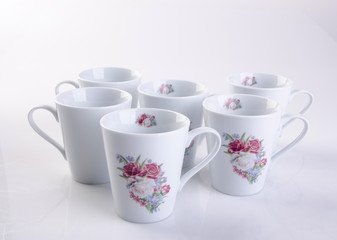 cup or hand painted flower ceramic mug set on the background new.