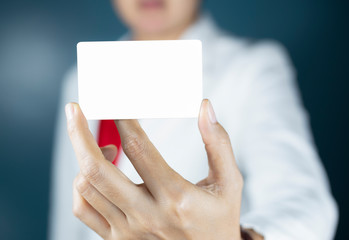 Hand holding  a blank piece of paper. Close up  white business card.