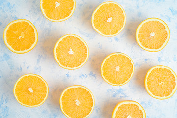 oranges for making juice, pattern, on a blue background