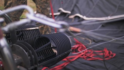 Adventure on hot air balloon watermelon. Burner directing flame into envelope and cold air by ventilating fan blower. Hot air burning gas fire to air balloon or aerostat during flight.