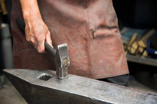 Man working in black smithery