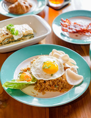 Fried rice with sunny side up eggs ready to eat for breakfast.