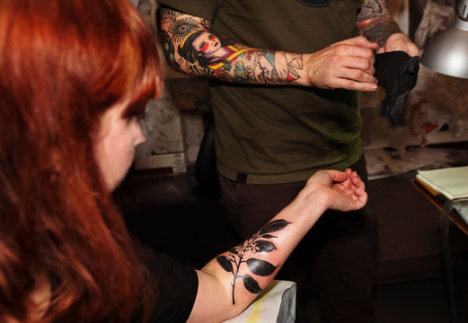 Woman In Tattoo Studio