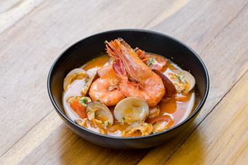A bowl of fresh tom yum with big size prawn and clams.