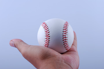 Hand hold A professional baseball isolated on white.