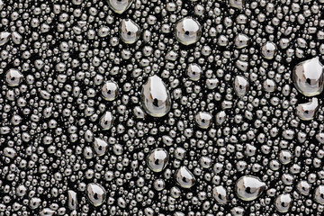 Grey surface with drops of rain water