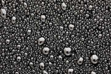 Grey surface with drops of rain water