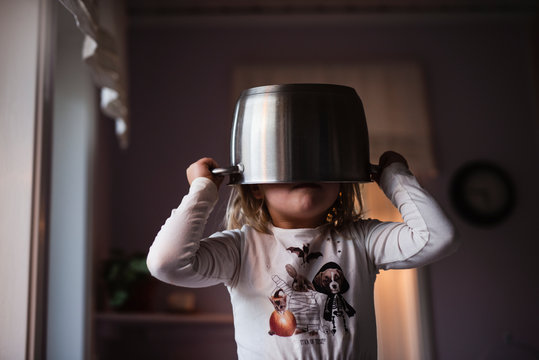 Girl wearing pot on head