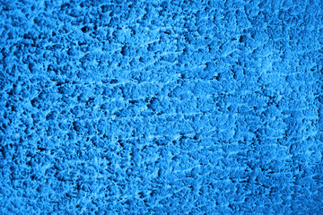 Fototapeta na wymiar Blue colored house front, structured with spatula techniques. Background design.
