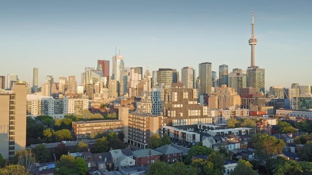 Aerial: Establishing shot of the downtown Toronto city skyline at sunset