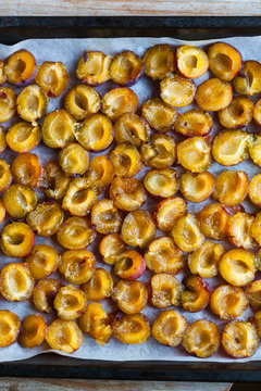 Plums on baking tray