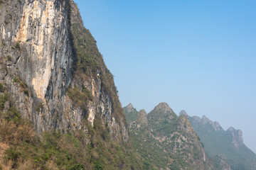 Karst formation and foggy limestone mountain landscape between Guiling and Yangshuo, Guangxi province, China