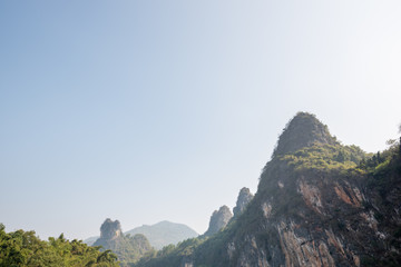Karst formation and foggy limestone mountain landscape between Guiling and Yangshuo, Guangxi province, China