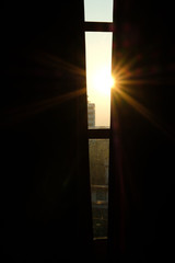 morning sunlight light ray through window curtain.