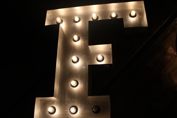 lamp-lit letter F in the dark