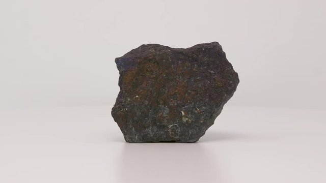 Close view of Bornite. Peacock ore specimen. Rotating back to front.