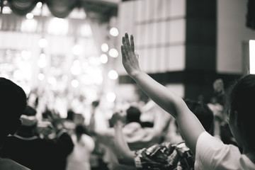 Fototapeta premium soft focus of Christian worship with raised hand,music concert