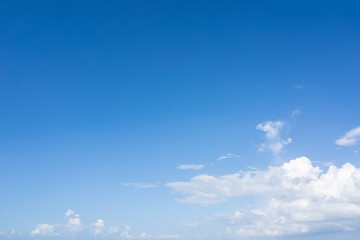 Blue sky and white puffy clouds