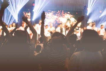 soft focus of Christian worship with raised hand,music concert