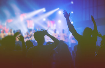 Obraz na płótnie Canvas soft focus of Christian worship with raised hand,music concert