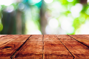 Empty wooden table with blurred on nature bokeh background