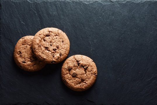 chocolate chip cookies on a stone board. Top view