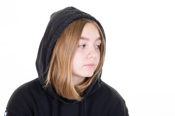 Girl in black Sweater looking aside over white background