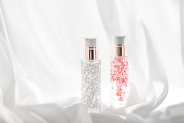 Skincare serum and make-up primer gel bottle, moisturizing lotion and lifting cream emulsion,...