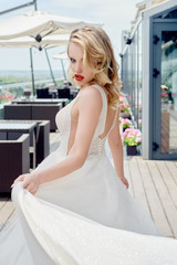 Portrait of beautiful bride wearing fashion wedding dress with luxury make-up and hairstyle...