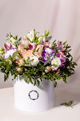 A magnificent bouquet of flowers on a light background. Wedding bouquet for the bride.