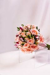 A magnificent bouquet of flowers on a light background. Wedding bouquet for the bride.