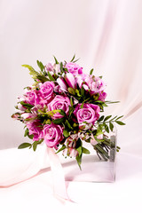 A magnificent bouquet of flowers on a light background. Wedding bouquet for the bride.